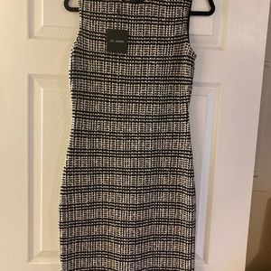 Size 6 St. John dress. NWT. Willing to ship immediately.